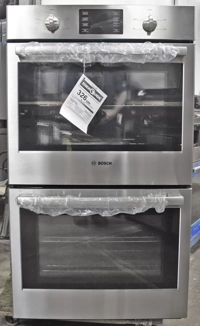 A close-up of a brand new Bosch 500 Series HBL5551UC 30-inch Double Electric Wall Oven.