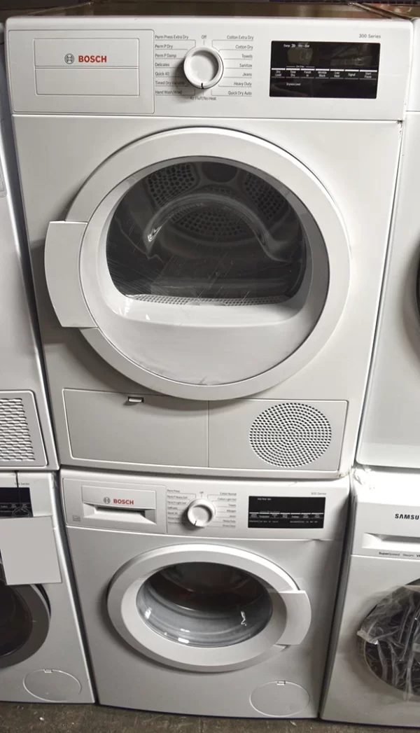 A close-up of a Bosch 300 Series WTG86403UC 24-inch Electric Dryer and WAT28400UC washer.