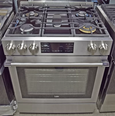 A close-up of a Beko SLGR30530SS 30 inch Slide-In Gas Range, Stainless Steel