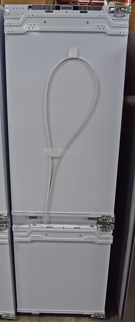 A close-up of a brand new Blomberg BRFB1052FFBI2 22-inch Bottom Freezer Refrigerator Panel mount.