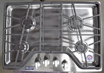A complete top view of a brand new Maytag MGC7430DS 30-inch Gas Cooktop with four Sealed burners.