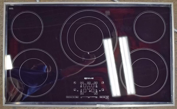 An overhead shot of a brand new Jenn-Air JEC4536BS 36-Inch Electric Radiant Cooktop with Glass-Touch Electronic Controls.