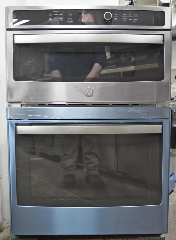 A front shot of a brand new GE JT3800SHSS 30-Inch Combination Wall Oven Microwave with Sensor Cooking.